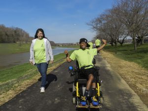 Woman and man walking on a path