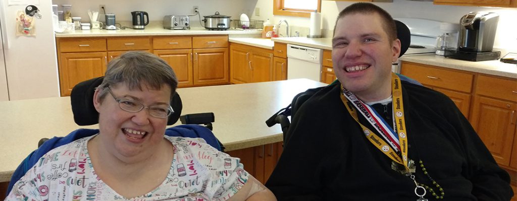 Picture of Corey and his girlfriend together in the group home they share with 4 other people with disabilities