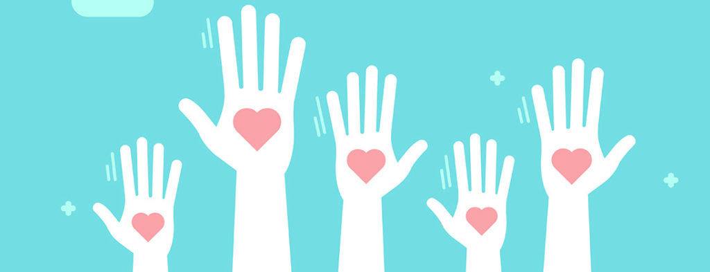 Photo of hands reaching up to the sky with hearts on them. Showing comapssion.