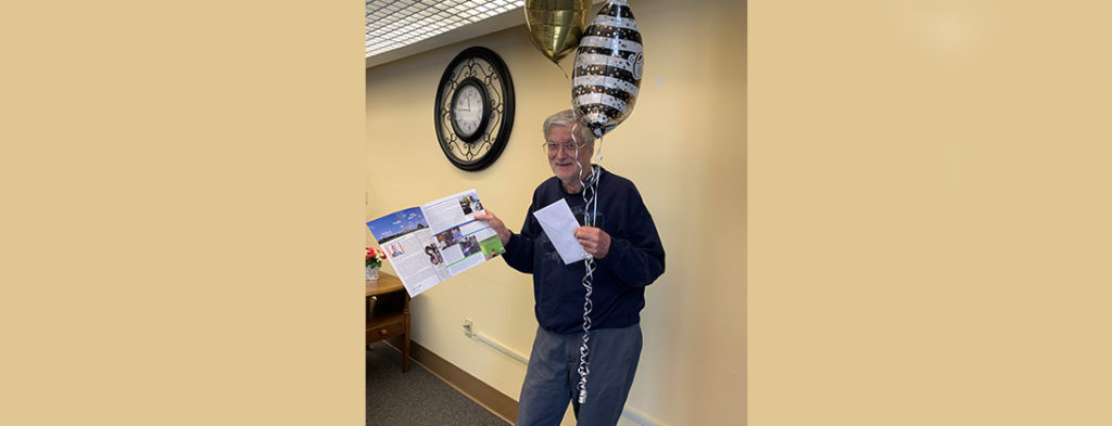 Picture of Gordon who lives at Echoing Hills Central Ohio smiling and holding a balloon