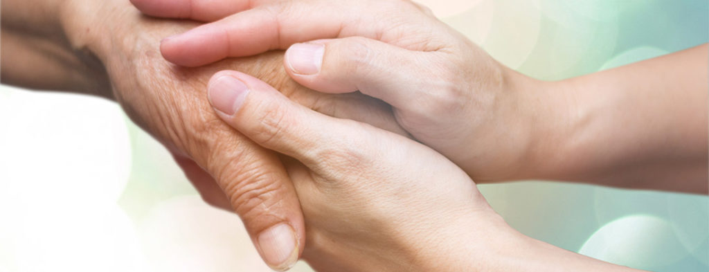 Photo of hands embracing each other showing kindness and compassion