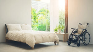 Handicap assessible hotel room with beautiful view and sunlight streaming through the window. Room for a wheelchair