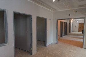 Beverly Avenue New Build interior with many doorways leading to individual bedrooms and living space.
