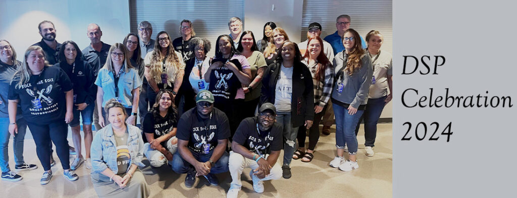 Group photo featuring Direct Support Professionals smiling.