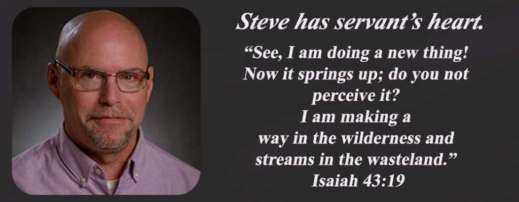 Steve is shown wearing a purple shirt. he is slightly balding and wears glasses. Echoing Hills team member, employee, staff.